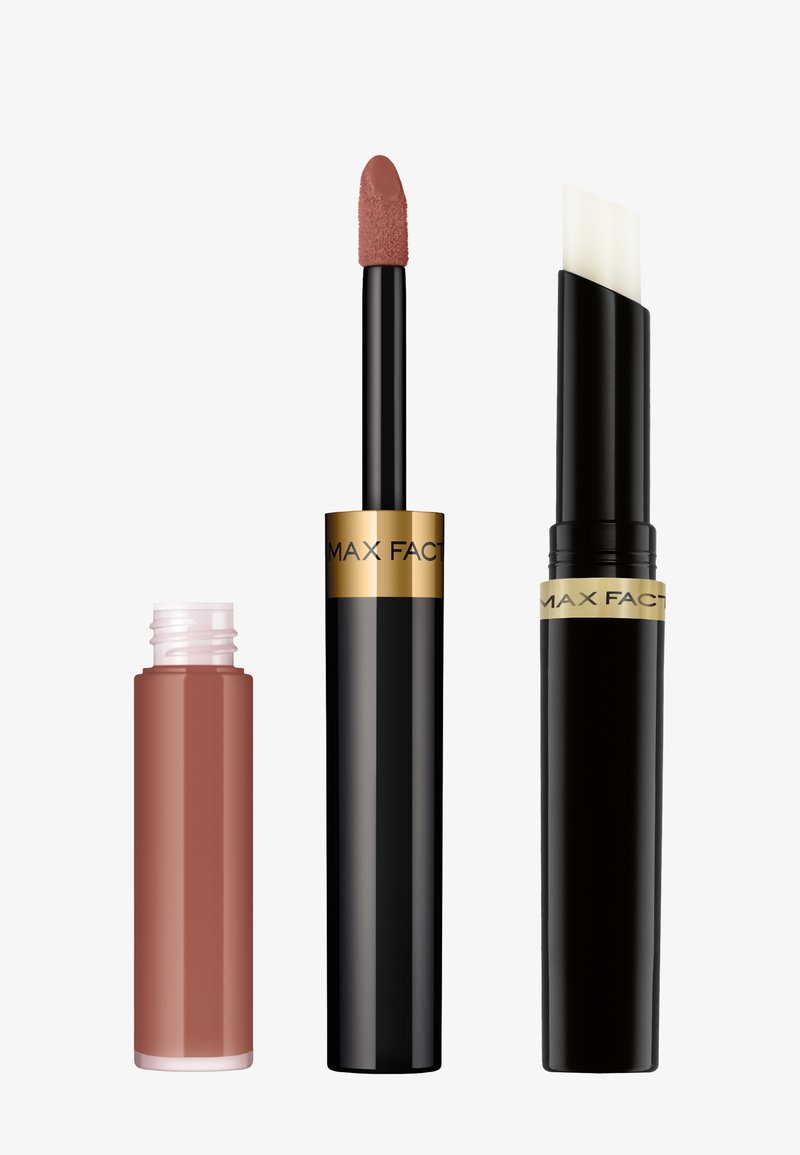 Max Factor læbeprodukter: en nude flydende læbestift i en klar tube, en sort tube med en hvid applikator, begge med gyldne detaljer.