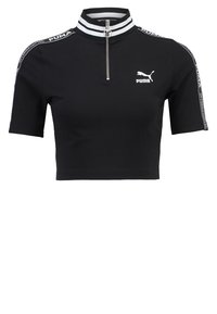 Černý zkrácený sportovní top Puma s krátkými rukávy, předním zipem do poloviny, pruhovaným límečkem a logem Puma na hrudi a na pruhovaných rukávech.