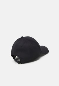 Black mesh baseball cap with a curved brim, textured fabric, adjustable strap at the back, and a ventilation hole on top.