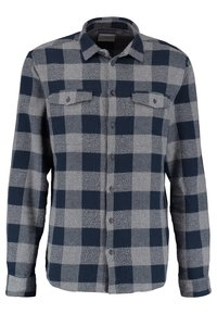 Gekruiste button-up shirt in marineblauw en grijs, gemaakt van zachte stof. Kenmerken zijn een kraag, lange mouwen en twee borstzakken.