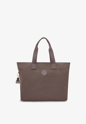 Brown nylon tote bag with dual handles, round logo patch at center, and small monkey keychain attached to the side zipper.