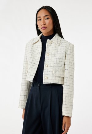 Witte en marineblauwe geruite cropped jasje van textuurstof, met een kraag, knopen aan de voorkant en zijzakken.