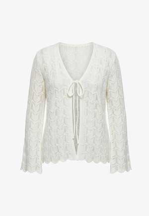 Cárdigan blanco de punto con patrón de chevrón, mangas largas acampanadas, dobladillo con bordes ondulados y parte delantera abierta atada con un lazo en el pecho.