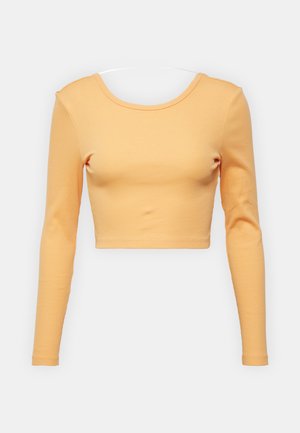 Top scurt cu mâneci lungi, dintr-un material moale și ribflat. Culoare galben-portocalie strălucitoare, cu un decolteu rotund. Material elastic pentru confort.