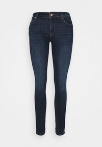 Jeans ajustados de mezclilla oscura, con un diseño clásico de cinco bolsillos, cremallera y un botón de cobre en la cintura.