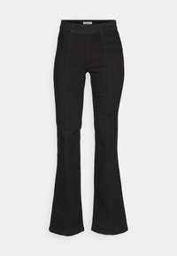 Svarta utsvängda jeans i denim, med hög midja, subtila sömdetaljer fram och en klassisk femfickdesign.