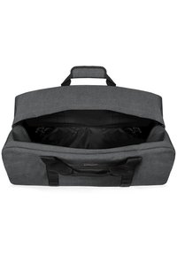 Borsone in tessuto grigio con ampia apertura, interno nero e robuste maniglie nere. Forma rettangolare semplice senza hardware visibile.