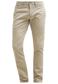 Beige chinot, joissa on sileä pinta, kapea malli, säädettävä vyötärö, nappi- ja vetoketjukiinnitys, sekä sivu- ja takataskut.
