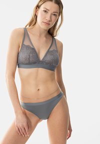 Gray bralette with lace detailing and mesh panels, paired with a matching gray bikini bottom. Flat seams and minimalistic design.