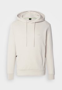 Felpa cappuccio color beige chiaro realizzata in tessuto morbido. Presenta una tasca frontale con ingresso laterale e un logo discreto sul petto.