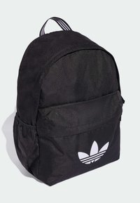 Black backpack with a curved top, made of durable fabric. Features a front pocket and a white logo, with striped shoulder straps.