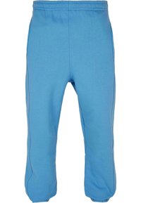Lichtblauwe sweatpants, gemaakt van zachte stof, met een elastische tailleband, zijzakken en contrasterende zijnaad.