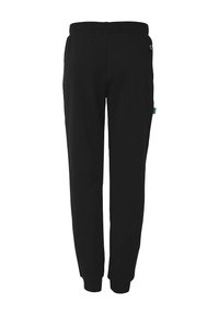 Sorte sweatpants med elastisk talje, tapered benform og sidelommer. Lavet af blødt materiale med et lille logo-mærke.