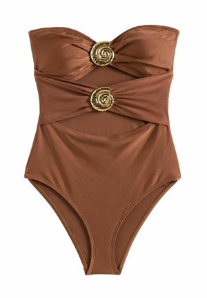 Mélybarna, pánt nélküli fürdőruha két aranyspirál formájú kagylódíszítéssel, melltartó alatti és hasrészen kivágásokkal.