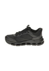Sneaker atletico nero con tomaia in rete, collare imbottito, design con lacci e suola spessa ventilata per corsa o uso casual.