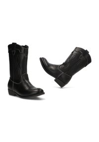Botas de vaquero de cuero negro con costuras decorativas, punteras puntiagudas y tacones bajos en bloque. Cuentan con lengüetas para facilitar el uso.