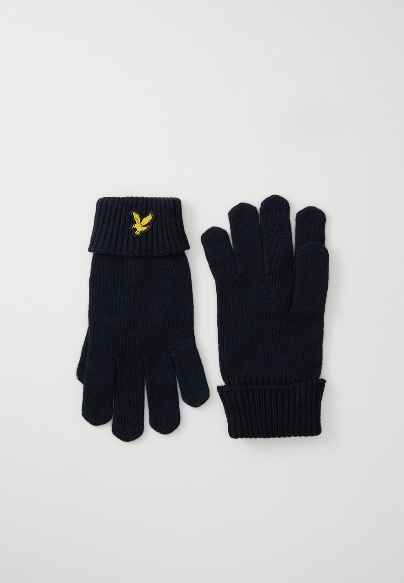 Luvas tricotadas em azul-marinho com punhos canelados. Apresentam um pequeno logotipo de águia bordado a dourado no punho. Textura suave e design com dedos.
