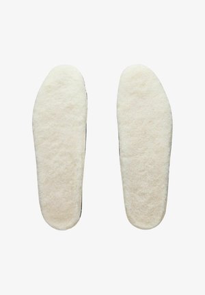 Felt insoles in cream color, featuring a soft texture and smooth edges, designed to provide comfort and warmth inside footwear.