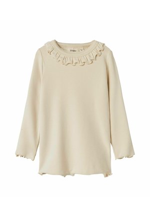 Camicia a maniche lunghe di un beige chiaro con collo arricciato e polsini scallop. Tessuto morbido, orlo dritto con spacchi laterali e etichetta logo discreta.