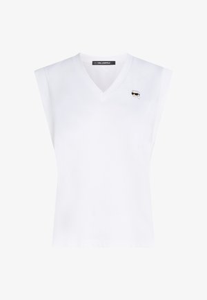 Top bianco senza maniche con scollatura a V. Presenta un piccolo dettaglio grafico sulla parte superiore sinistra del petto. Tessuto liscio, taglio classico.