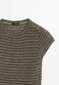 Knit short-sleeve top in dark gray with a textured, open-weave pattern. Round neckline with a subtle ribbed edge.