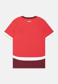Red sports jersey featuring a round neck with a dark maroon trim, short sleeves, and white and maroon stripes near the hem.