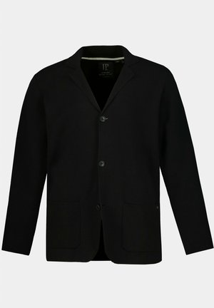 Schwarzer Blazer mit Reverskragen, zwei Fronttaschen, drei Knöpfen und einem strukturierten Stoff. Verfügt über dezente Details am inneren Kragen.