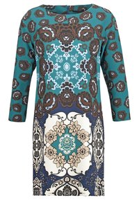 Turkos klänning med långa ärmar som har blommiga och geometriska mönster i brunt, krämfärgat och blått. Slätt tyg med rund halsringning.