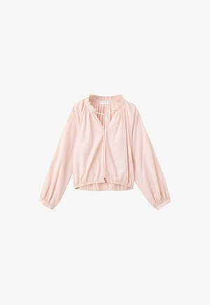 Blouse rose pâle à manches longues avec poignets élastiques, col froncé et fermeture à nouer à l'avant.
