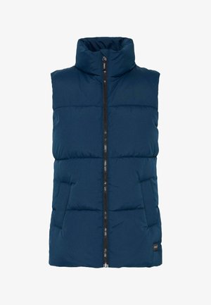 Marineblå polstret vest med høj krave, lynlås hele vejen ned foran og to sidelommer. Glat tekstur med syede vandrette sektioner.