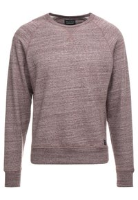 Felpa girocollo color bordeaux con tessuto testurizzato, maniche raglan e orlo dritto. Presenta una piccola etichetta nera del marchio sul lato inferiore.