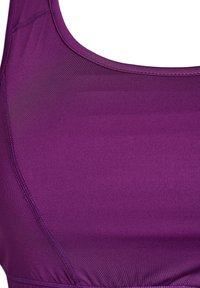 Vijoličen športni modrček iz gladkega, strukturiranega materiala. Ima ovratnik v obliki izreza in ojačane šive za trajnost.