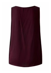 Burgundy sleeveless top with a round neckline, made of soft fabric, featuring a loose fit and side slits for ease of movement.
