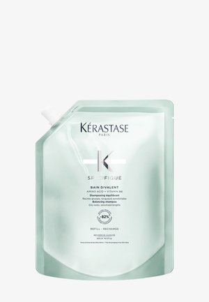 Kérastase Specifique Bain Divalent shampoo, in a transparent mint-green pouch, features a resealable top and minimalistic silver text.