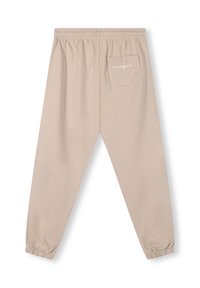 Beige joggings met een elastische tailleband, aansluitende boorden en een achterzak met witte opdruk. Glad, zacht stofmateriaal.