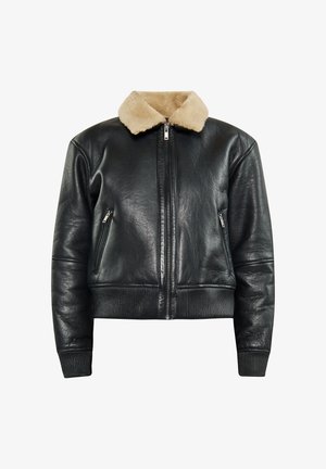 Černá kožená bomber bunda s béžovým umělým kožešinovým límcem, předním zipovým zapínáním a pružnými manžetami a spodním lemem. Obsahuje dvě boční kapsy na zip.