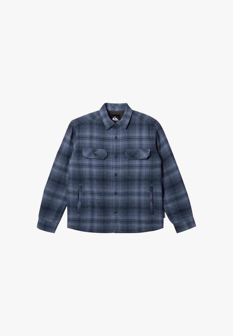 Chemise à carreaux dans des tons bleu marine et gris, en tissu doux, avec une fermeture à boutons, deux poches poitrine et un col classique.