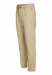 Beige lichte broek met een elastische tailleband, verstelbaar trekkoord, zijzakken en subtiele stiksels.