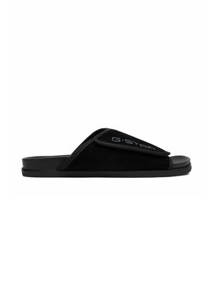 Schwarze Slides-Sandale mit verstellbarem Klettverschluss mit "G-STAR"-Markenlogo an der Seite, flacher Sohle und offenem Zeh-Design.