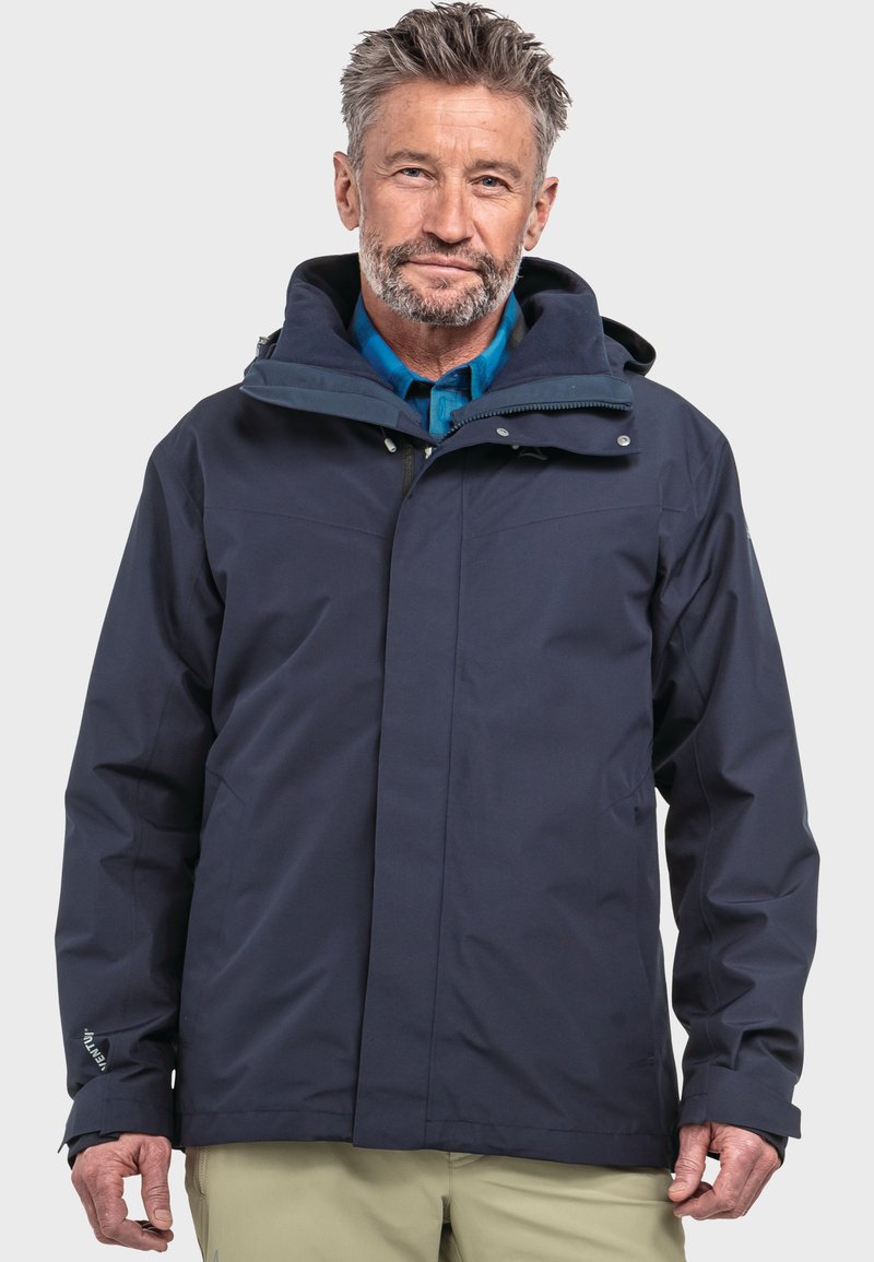 Marineblaue wasserdichte Jacke mit Kapuze, Frontreißverschluss und Druckknöpfen. Sie hat eine glatte Textur und verstellbare Bündchen, ideal für den Einsatz im Freien.