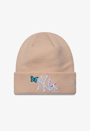Light peach beanie with ribbed texture, featuring white "NY" logo and embroidered details of a butterfly and rabbit. Soft knit material.