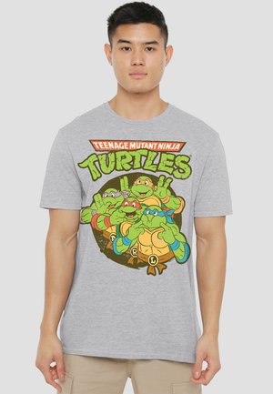 Gray cotton t-shirt featuring a vibrant graphic of four Teenage Mutant Ninja Turtles in a circular design with colorful accents.