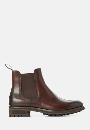 Brown leather Chelsea boots with elastic side panels, pull tab, and textured rubber sole. Smooth finish with sturdy low heel.