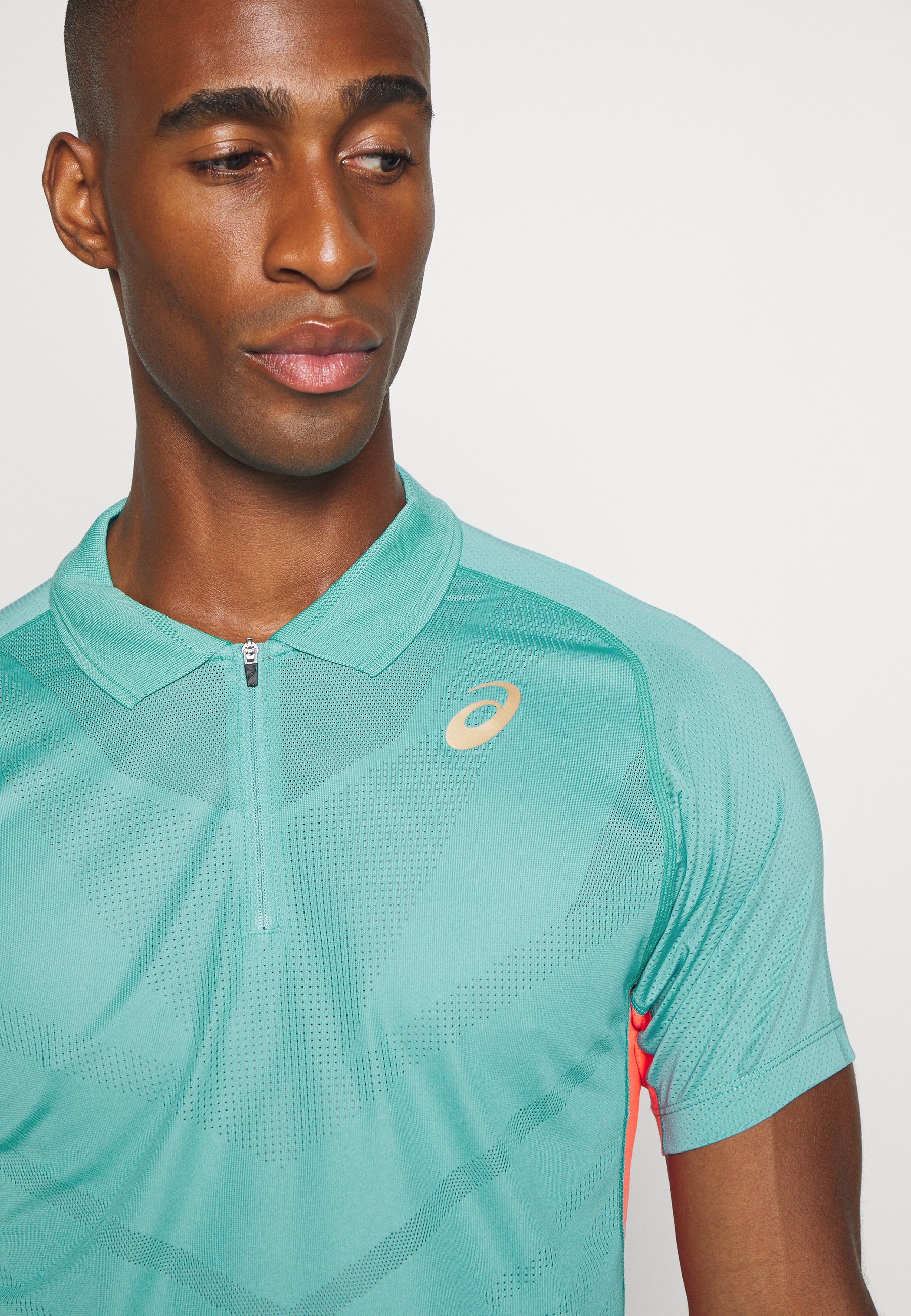polo asics homme cyan