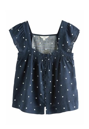 Granatowa lniana bluzka w białe kropki, z krótkimi bufkami, marszczonym dekoltem i guzikami obszytymi tkaniną z przodu.