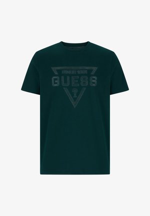 Ciemnozielona bawełniana koszulka z trójkątnym czarnym logo oraz napisami "GUESS" i "SINCE 1981" na przodzie.