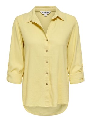 Lichtgele damesblouse met knopen, kraag en opgerolde mouwen tot aan de kuit, met het label "ONLY" in maat small.