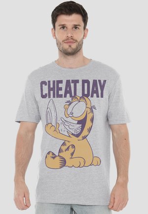 Gray cotton t-shirt featuring a cartoon graphic of a smiling cat holding a plate of food, with "CHEAT DAY" printed in purple text above.