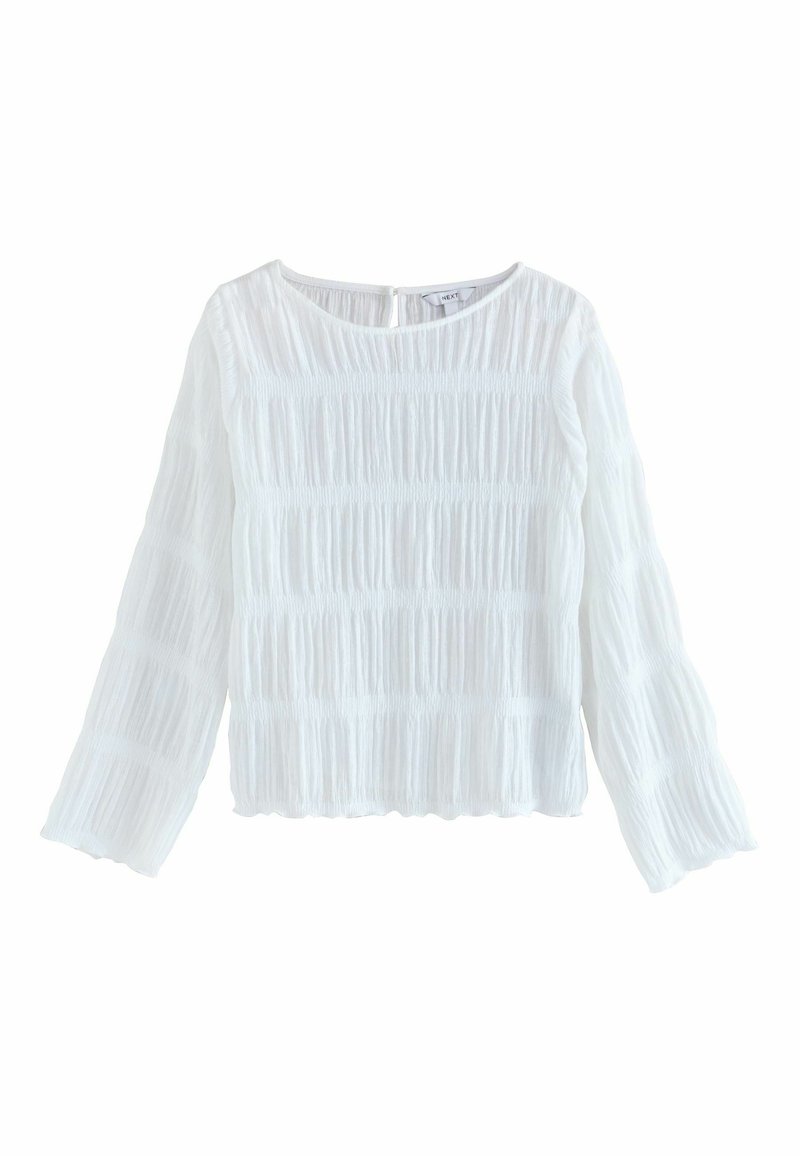 White long-sleeve blouse made of textured fabric with vertical pleats. Features a round neckline and a keyhole back closure.