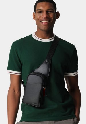 ESSENTIALS  - Cross body bag - black